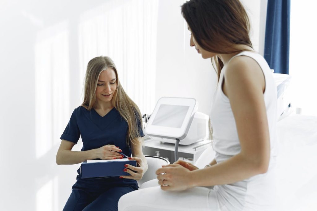 nurse reading results to patient