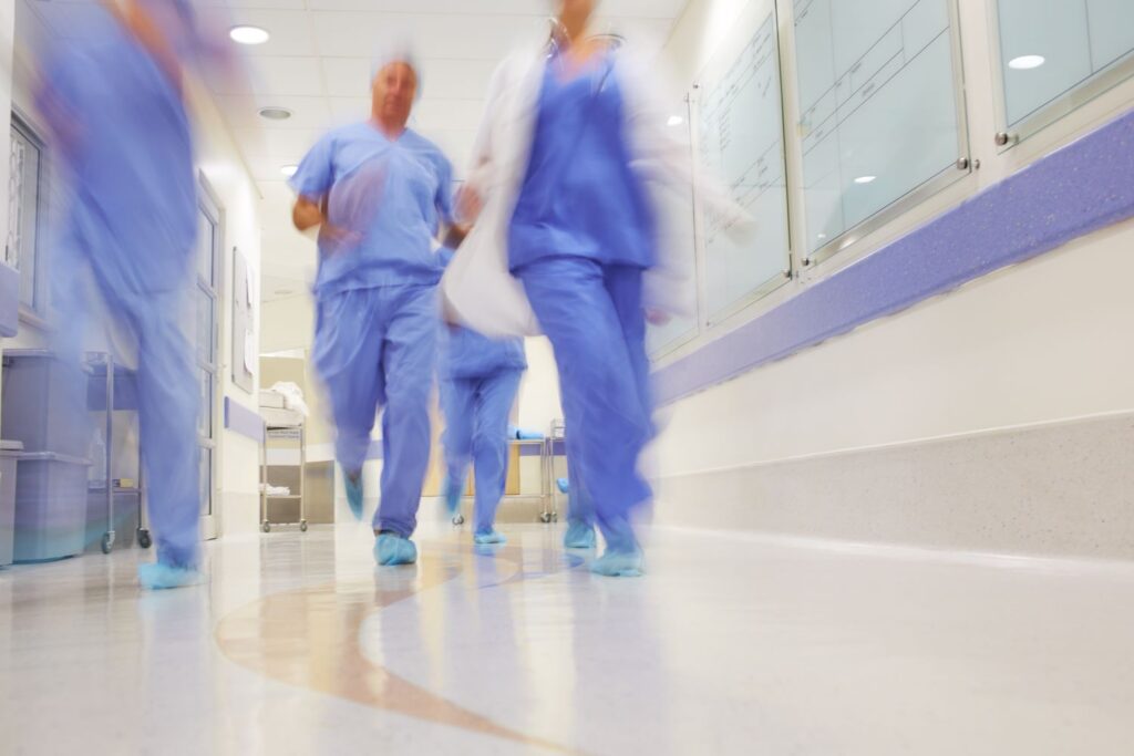 blurred image of health care workers running