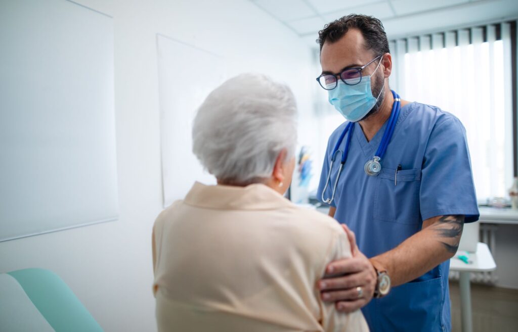 health care worker comforting patient