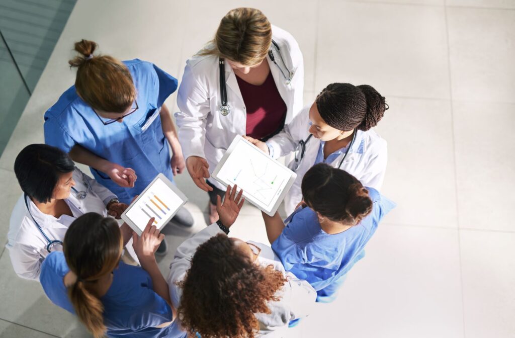health care workers in a huddle