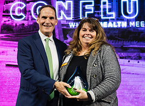 Rich Liekweg, MHA Board Chair and President and CEO of BJC Health Care, presents MHA's Aim for Excellence Award to Michelle Schafer, Regional Vice President of Behavioral Health at SSM Health in St. Louis.