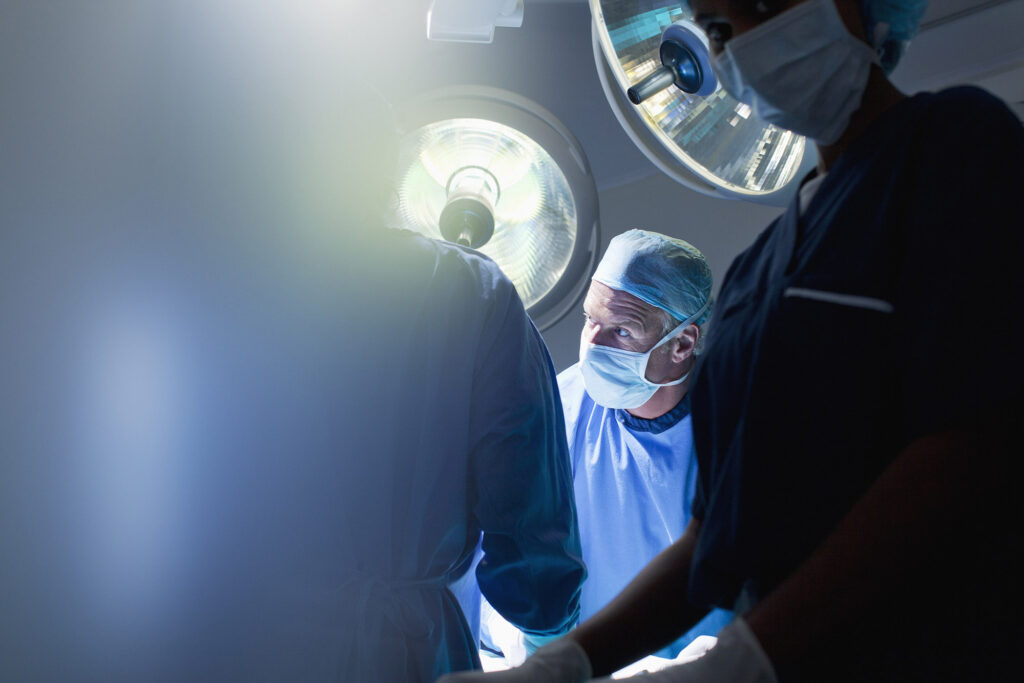 Surgeons working in operating room