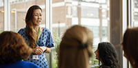 Asian businesswoman giving speech at women's networking event